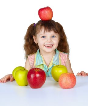 The little girl placed the apple on head