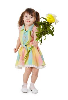 A happy little girl with a bouquet of flowers on a white background