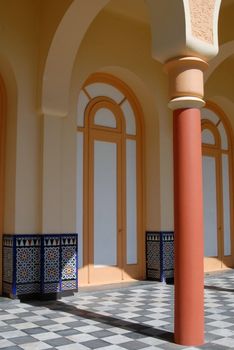 Architectural detail of an ancient building. Column and archs