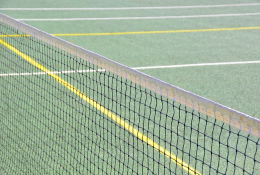 Closeup of tennis net on empty court