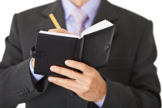 Man makes an entry in the organizer