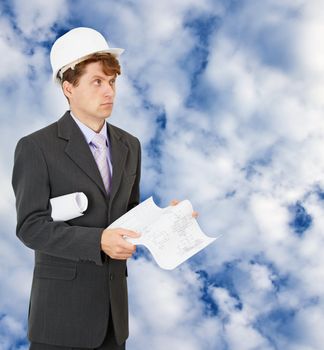 Engineer - builder on the background of the cloudy sky