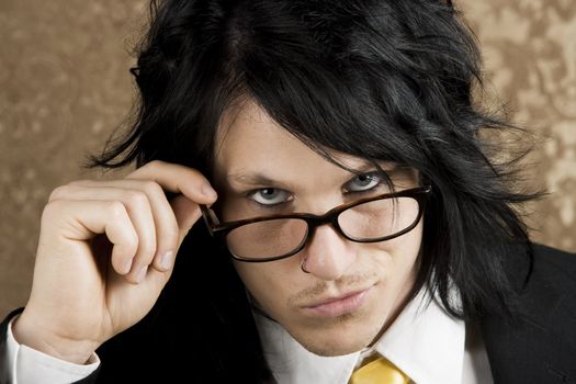 Handsome Young Man Looking Over the Top of his Glasses