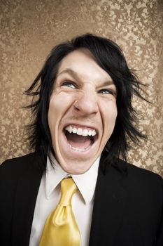 Screaming young man in a business suit and tie