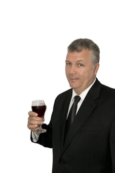 Middle-aged businessman toasting with a glass of wine.