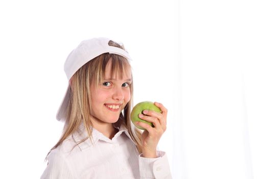 a young, blond girl with green apple and is in a cheerful-cutout