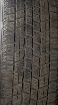 Old automobile tyre. A background
