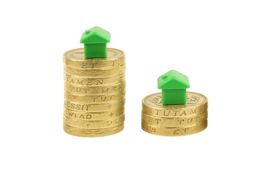 Concept, property stock market crash, pound coins isolated on white background