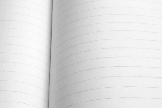 Close-up image of white lined notepad