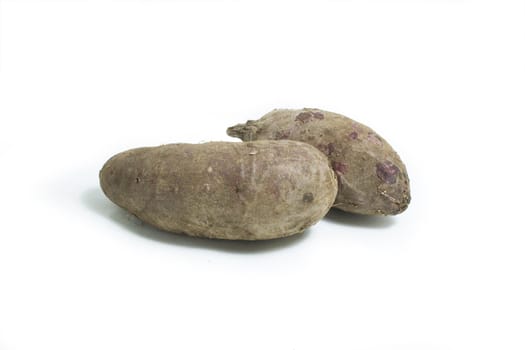 Two Sweet potato on white background.