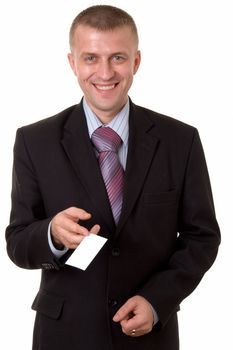 smiling young businessman holding a blank business card, isolated on white background
