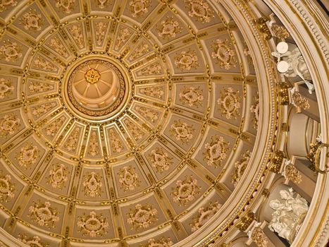 The rich and intricate decore inside of the dome at the church in Zurrieq in Malta