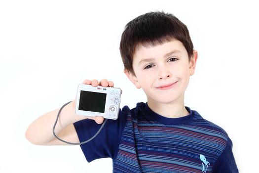 small boy with digital camera on white background