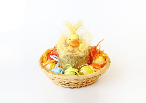 easter decoration with small duck and eggs on white background