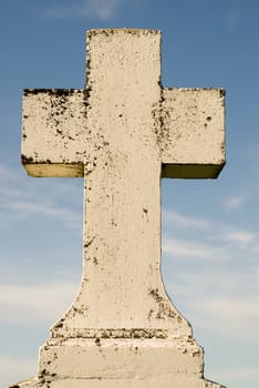 A burial cross shot against a blue sky