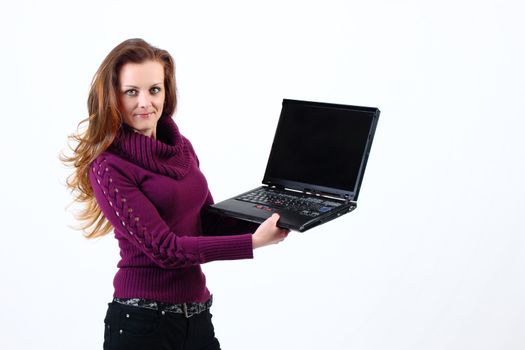 attractive woman shows her Notebook on white background