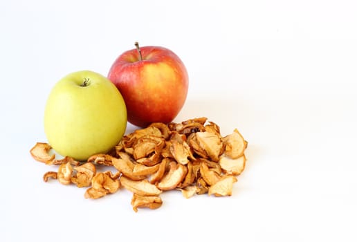 green red and dried apples on white background