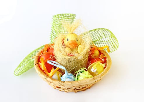 easter decoration with small duck and eggs on white background