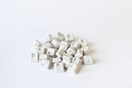 scattered keyboard keys on white background