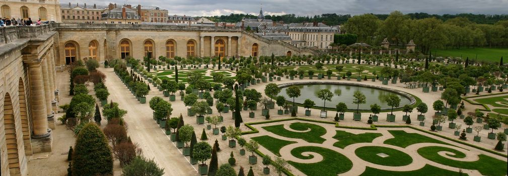 wide panorama of famous versailles orange garden in france