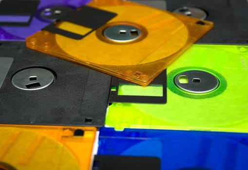 Background consisting of several diskettes of different colorA? Shallow DOF