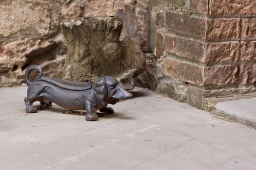 metal statue of badger-dog in the yard
