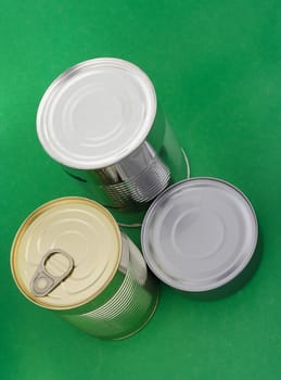 Three different food can, green background