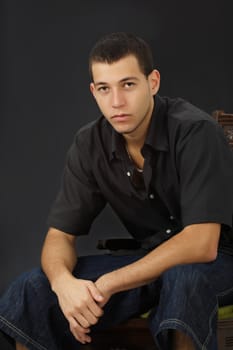 young caucasian man,, black background