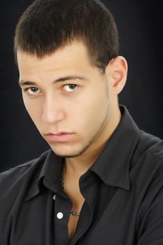 young caucasian man, black background