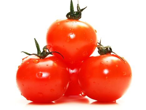 Fresh red tomato toward white background with green grass on top