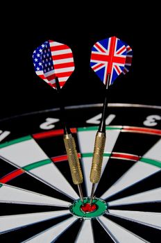 Dart arrows with american and english flag hitting the center