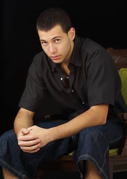 young caucasian man, black background