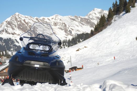 The snow mobile in the swiss Alpes