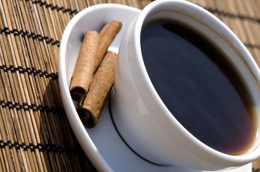 outside, in the sun, indulge with a strong black coffee