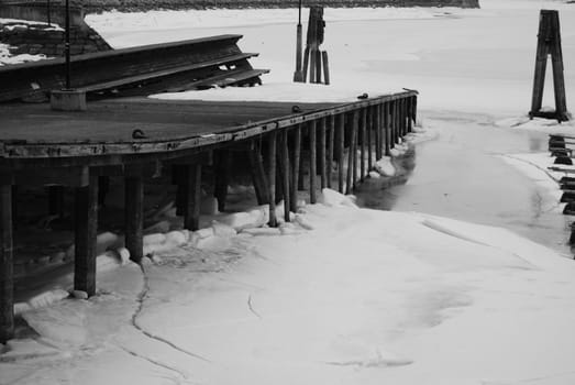 Wooden harbour in winter