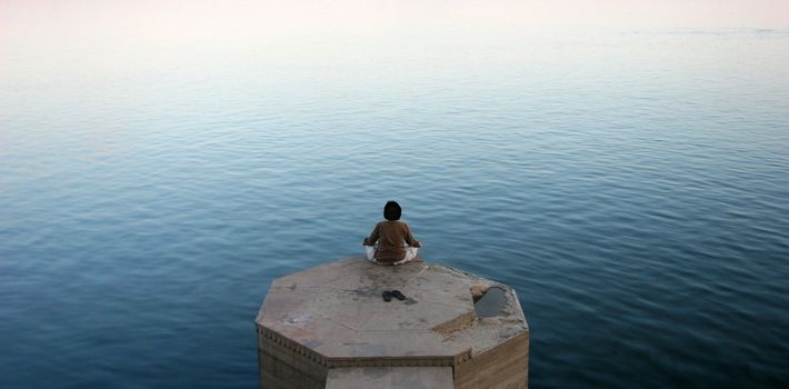 Meditation on a Ganges river bank, Varanasi