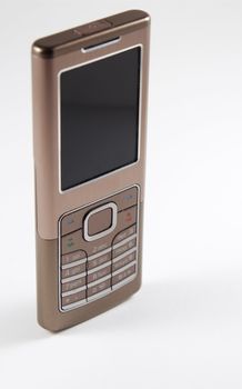 Vertical image of modern mobile phone. Focus on navigation button