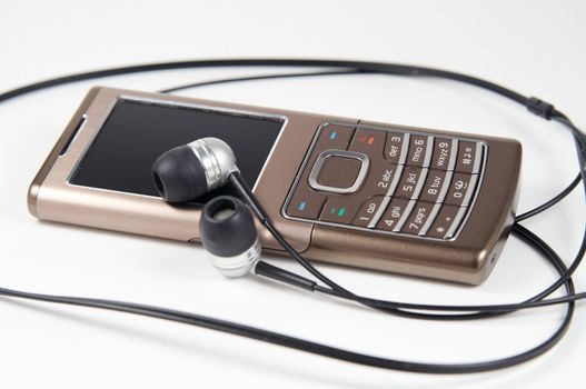 Modern thin mobile phone with headphones