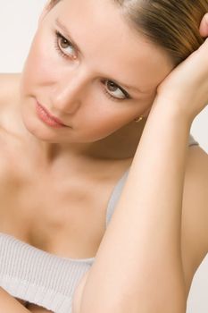 portrait of sad beautiful woman on white background