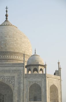 Close up view of the Taj Mahal mausoleum in Agra, India showing the primary dome as well as a corner dome.