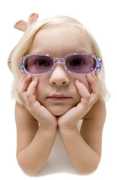 Little girl on white background wearing glasses