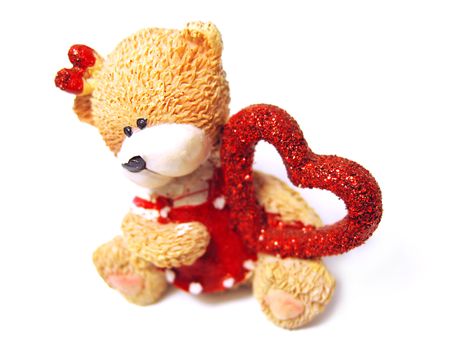 bear figurine with red heart isolated on white