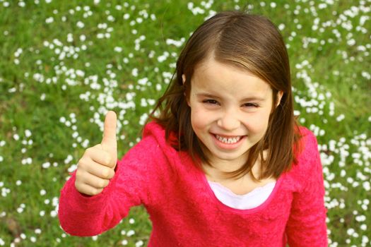 Cute girl with thumb up