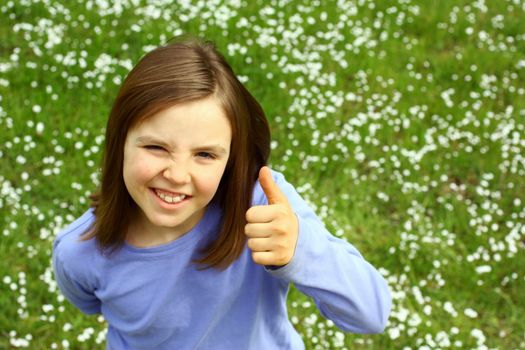 Cute girl with thumb up