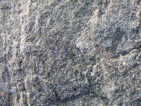 The rough surface of a gray stone