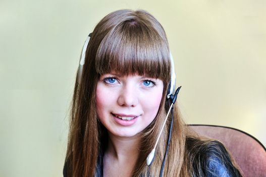 smiling blue-eyed girl operator with head set

