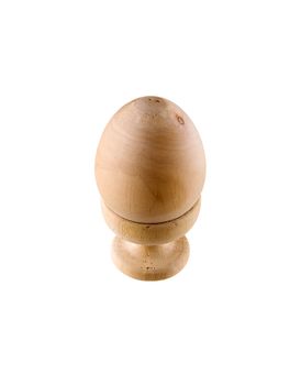 Wooden peaster egg on stand on white background