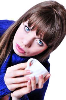 blue-eyed drinking girl wearing blue sweater
