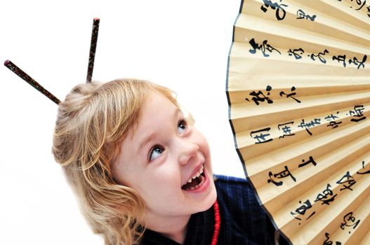  little girl with fan wearing like oriental girl
