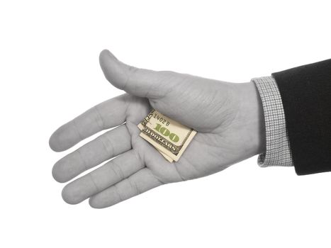 A man's black and white hand hiding a colorful hundred dollars tip.